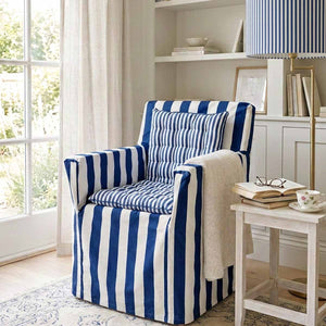 Deep blue and white striped cotton chair cover with smaller striped seat pad to transform a wooden directors chairs into comfortable indoor seating