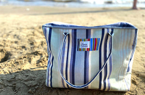 stripe travel bag on beach