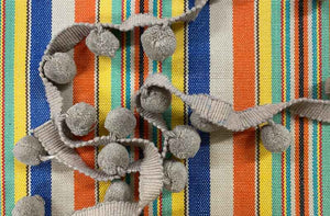 taupe-bobble-fringe-taupe-pompoms-on-solitaire-stripe-fabric.jpg