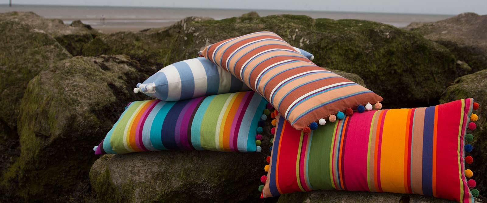 Orange, Blue, Jade Green, Yellow, Red Striped Oblong Cushions with Bobble Fringe