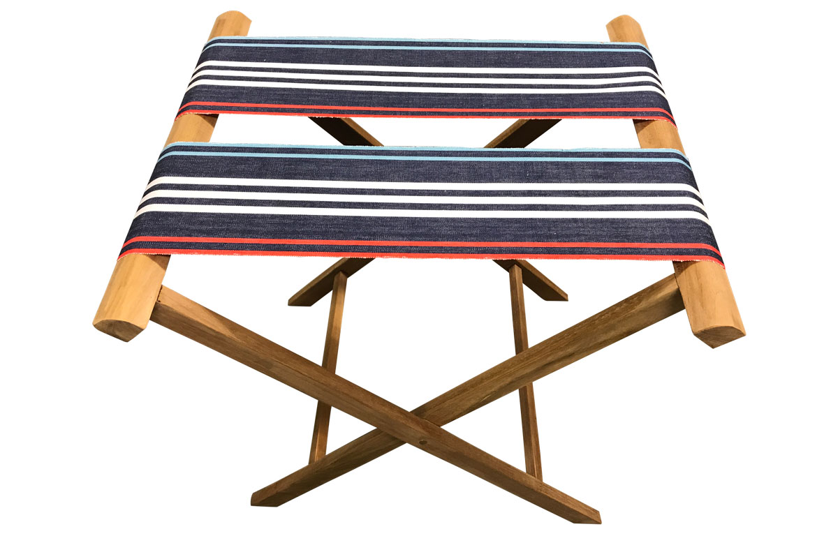 Folding Luggage Rack with extra wide webbing of navy blue, pale blue, red and white stripes