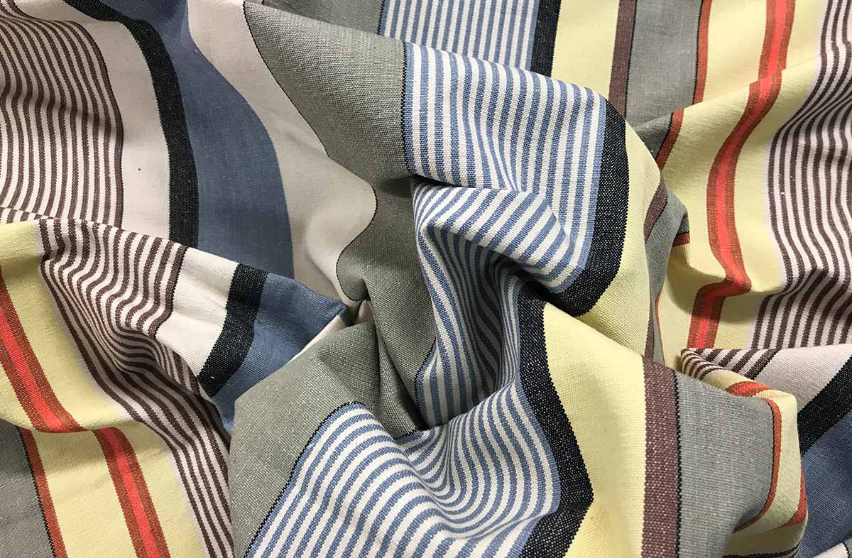 Striped Fabric of pale denim blue, oyster beige, light grey and lemon yellow stripes
