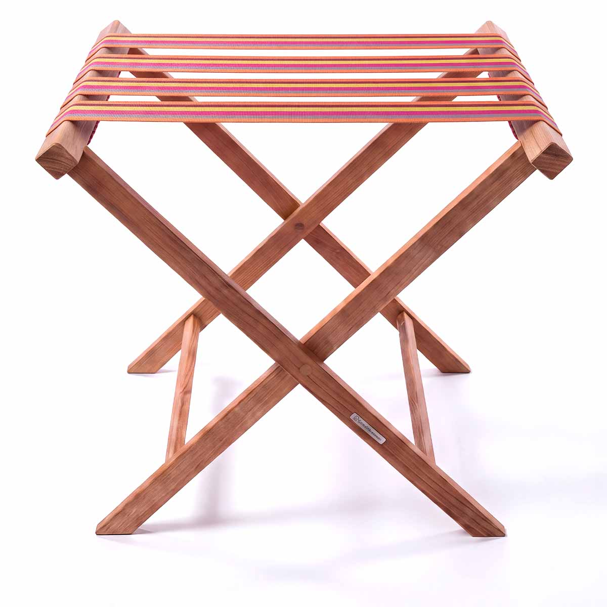 Folding wooden teak luggage rack with pink, yellow and terracotta stripe cotton webbing straps for hotel guest room