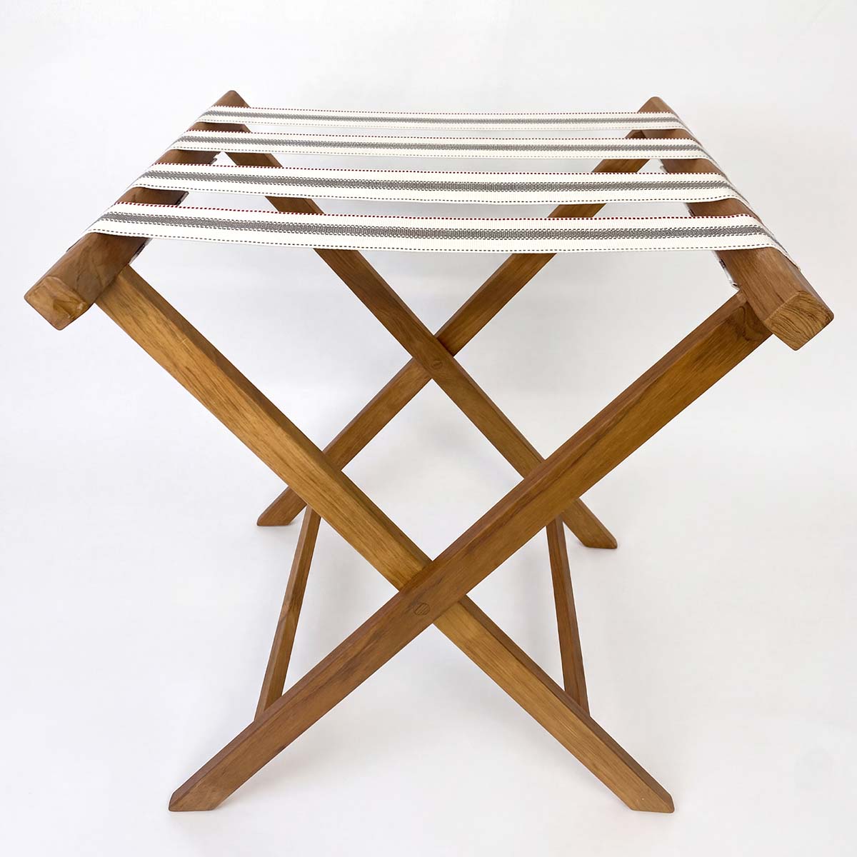 teak luggage rack with white grey and red stripe cotton webbing hotel guest room