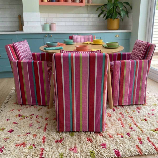 bright pink red and accent lime green and white striped Deep blue and white striped cotton chair cover with smaller striped magenta pink and white seat pad to transform a wooden directors chairs into comfortable indoor seating