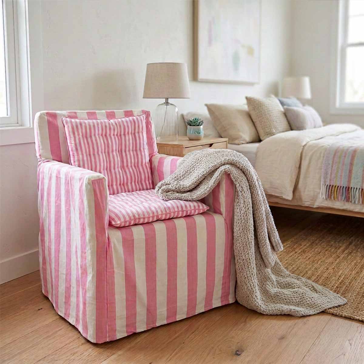 Candy pink and white striped cotton chair cover with smaller striped pink and white seat pad to transform a wooden directors chairs into comfortable indoor seating