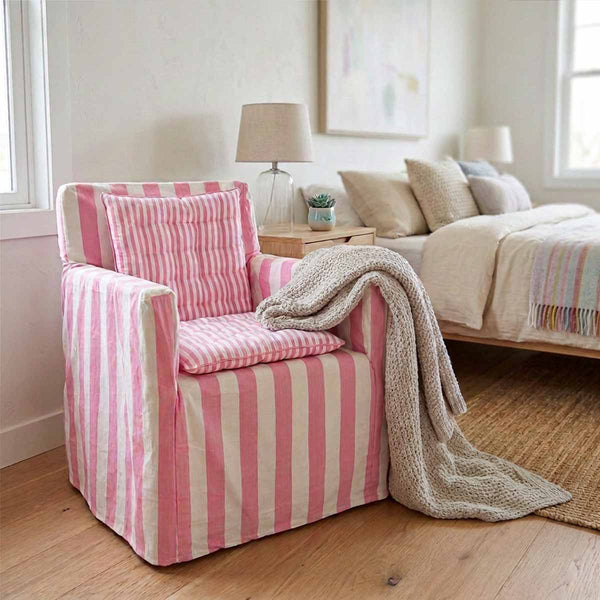 Candy pink and white striped cotton chair cover with smaller striped pink and white seat pad to transform a wooden directors chairs into comfortable indoor seating