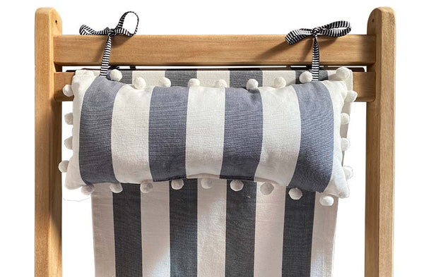 grey-white-stripe-headrest-white-pompoms-on-deckchair.jpg
