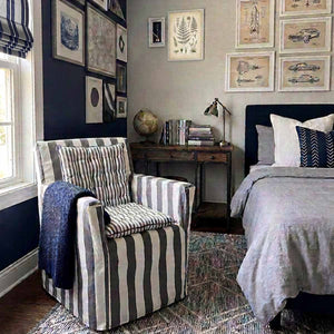 Grey and white striped cotton chair cover with smaller striped grey and white seat pads to transform a wooden directors chairs into comfortable indoor seating