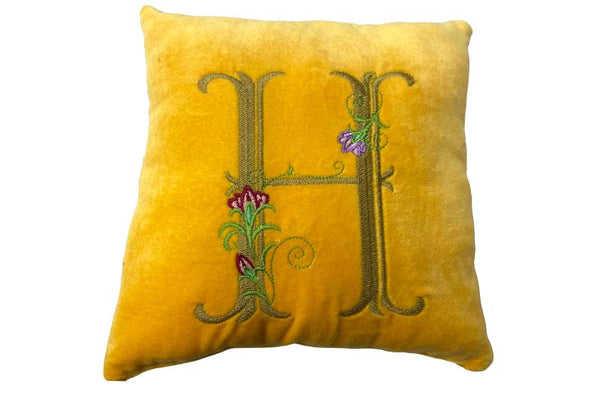 embroidery initial on velvet cushion