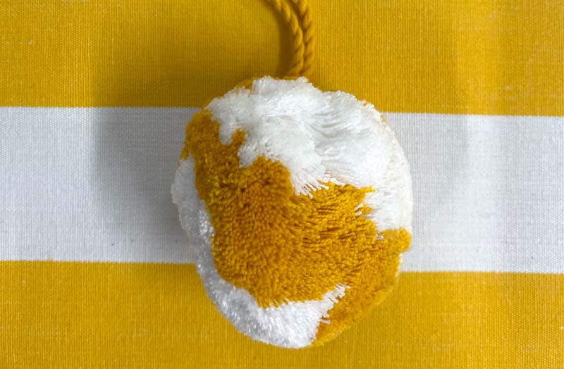 large-hanging-pom-pom-yellow-white_shotput.jpg