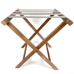 Folding wooden teak luggage rack with Mint Green, Denim and Cream stripe cotton webbing straps for hotel guest room