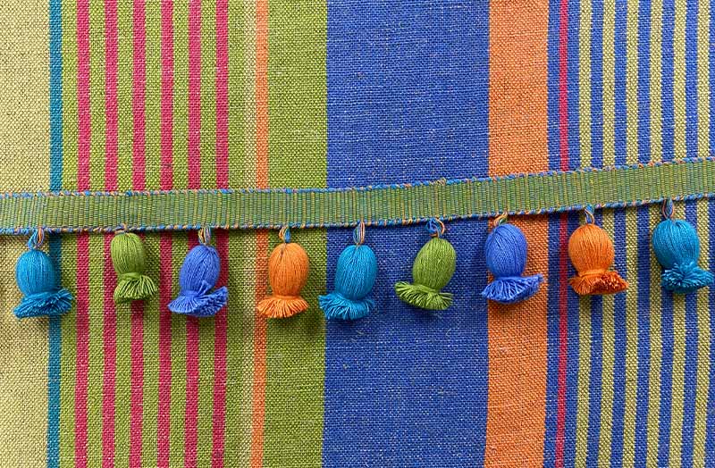linen/cotton mix fabric with onion fringe sea green, ocean blue, apple green, terracotta.