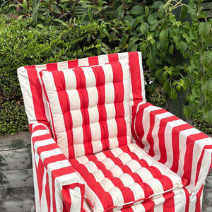 Red and off white striped seat pads on directors chair 