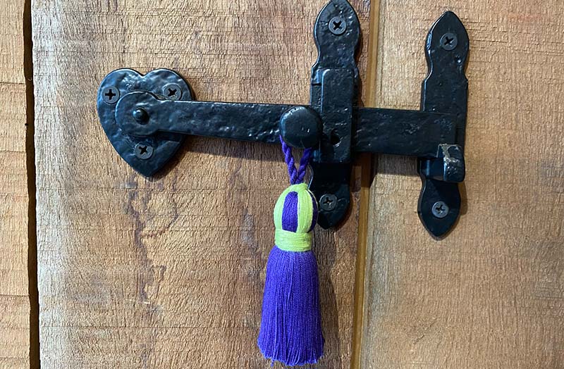 purple-small-decorative-tassel-on-door-latch.jpg