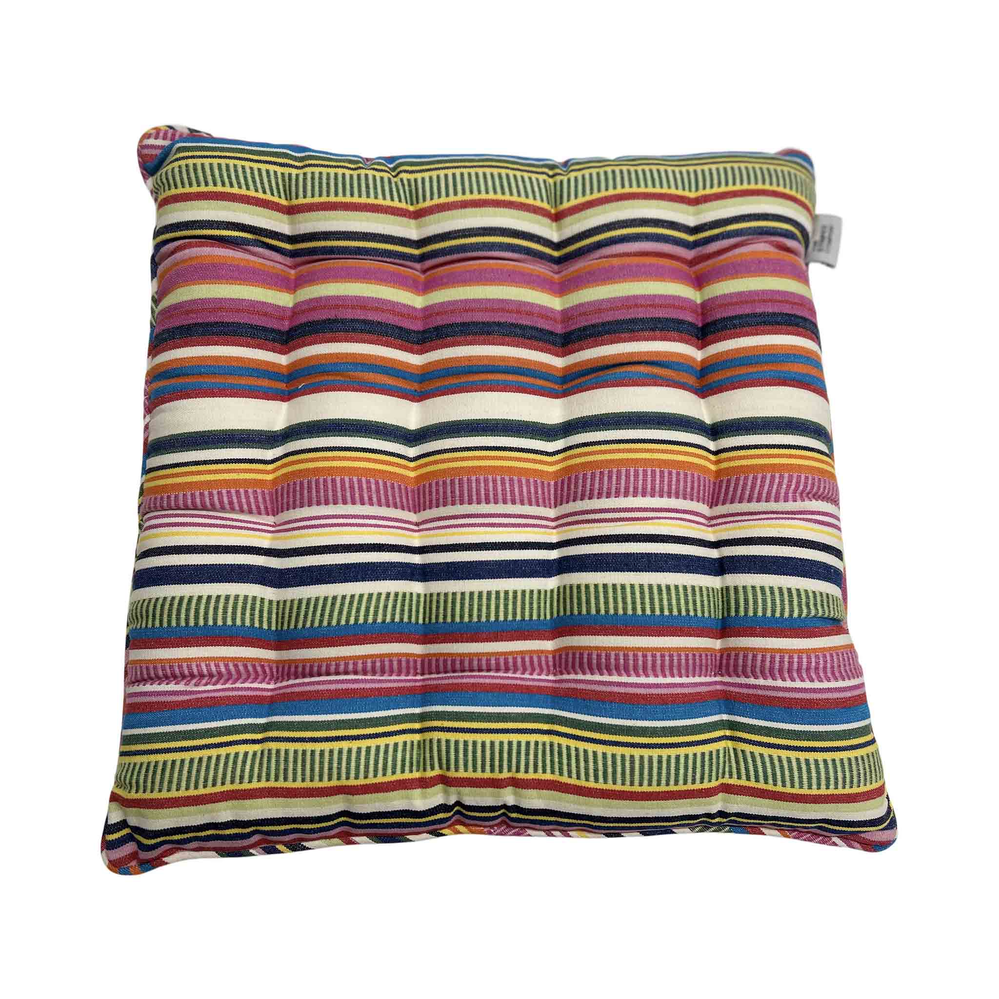 Multicolored striped cushion on a white background