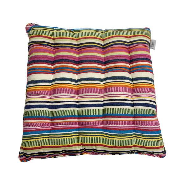 Multicolored striped cushion on a white background