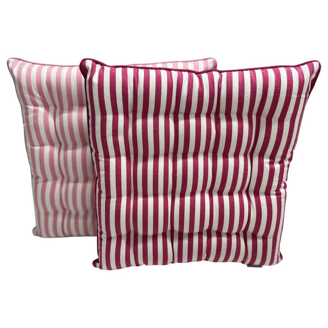 Two pink and white striped seat cushions on a white background
