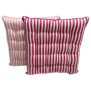 Two pink and white striped seat cushions on a white background