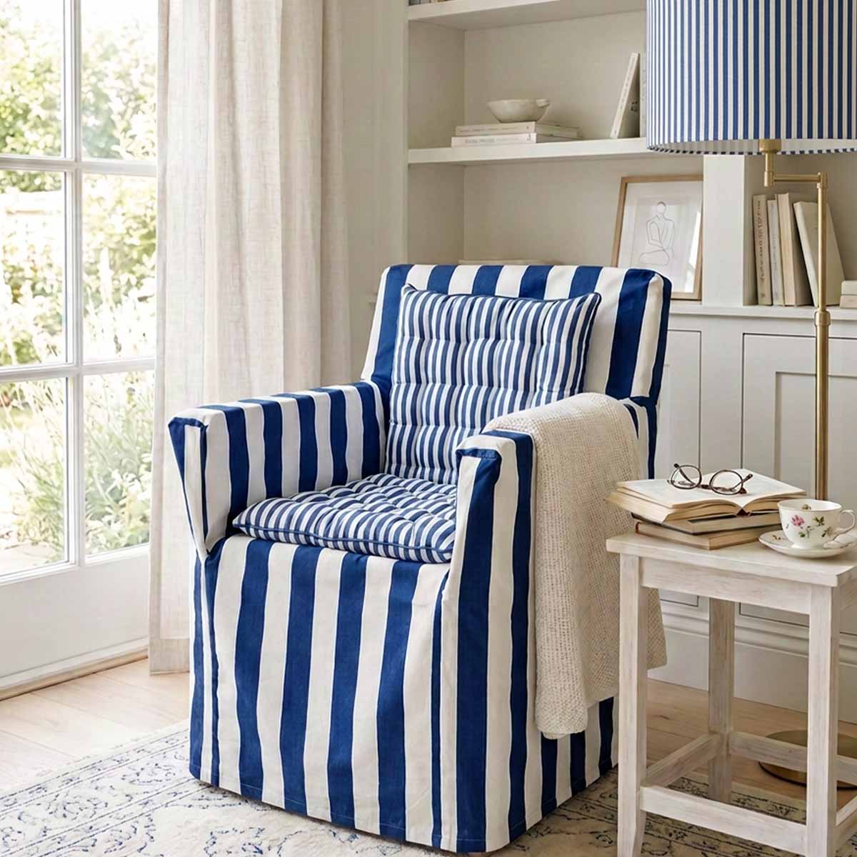 Deep blue and white striped cotton chair cover with smaller striped seat pad to transform a wooden directors chairs into comfortable indoor seating