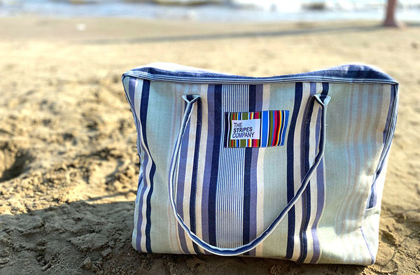 stripe travel bag on beach
