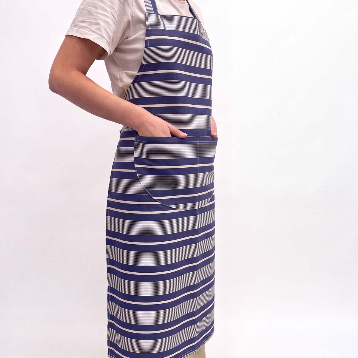 navy blue and white striped apron with a large front pocket