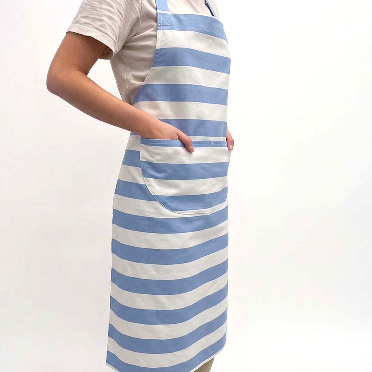 light blue and white horizontally striped apron with a large front pocket