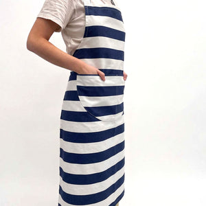 navy blue and white horizontally striped apron with a large front pocket