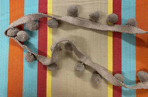 taupe-bobble-fringe-taupe-pompoms-on-dice-stripe-fabric.jpg