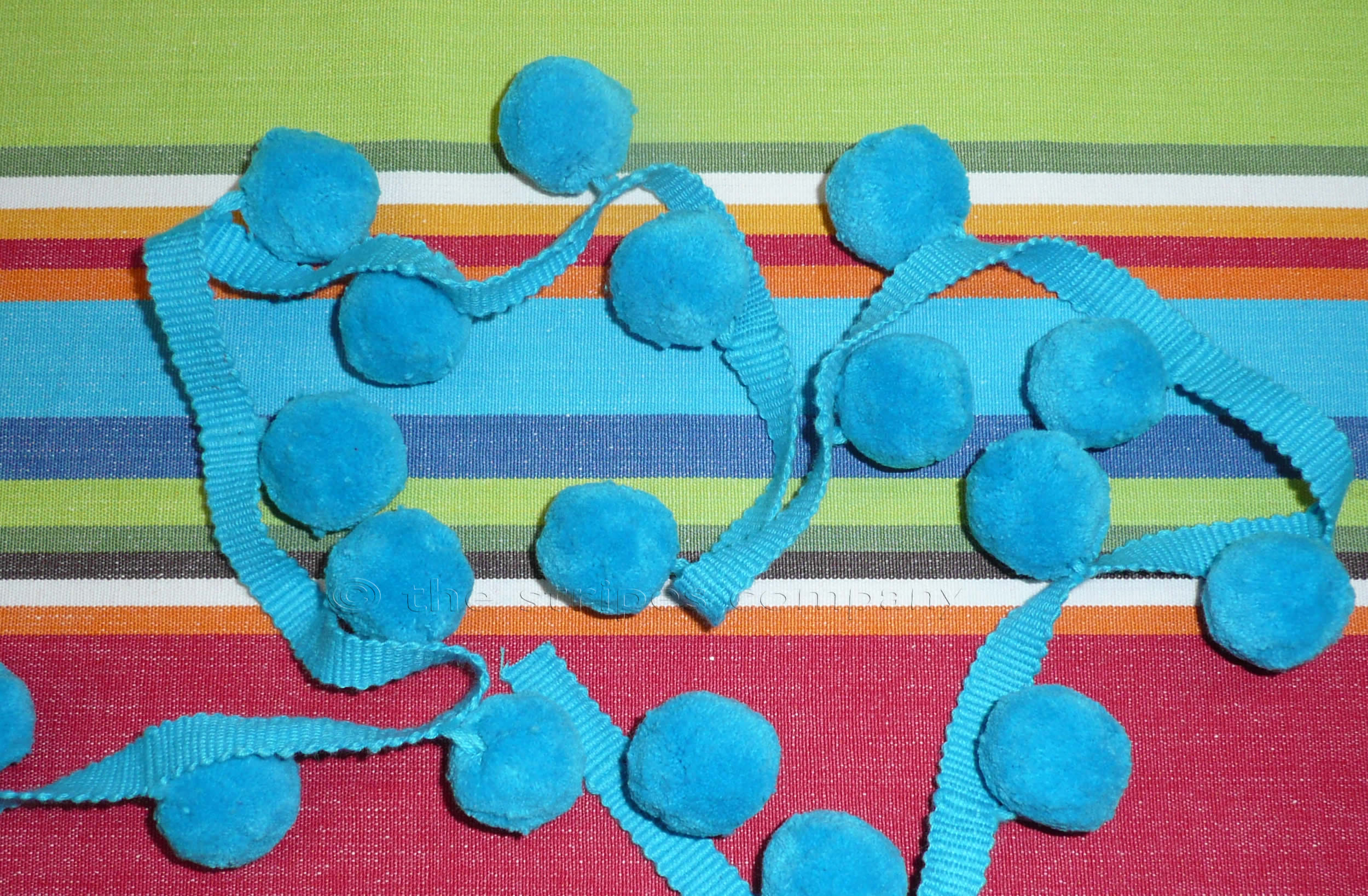 turquoise-bobble-fringe-large-turquoise-pompoms.jpg